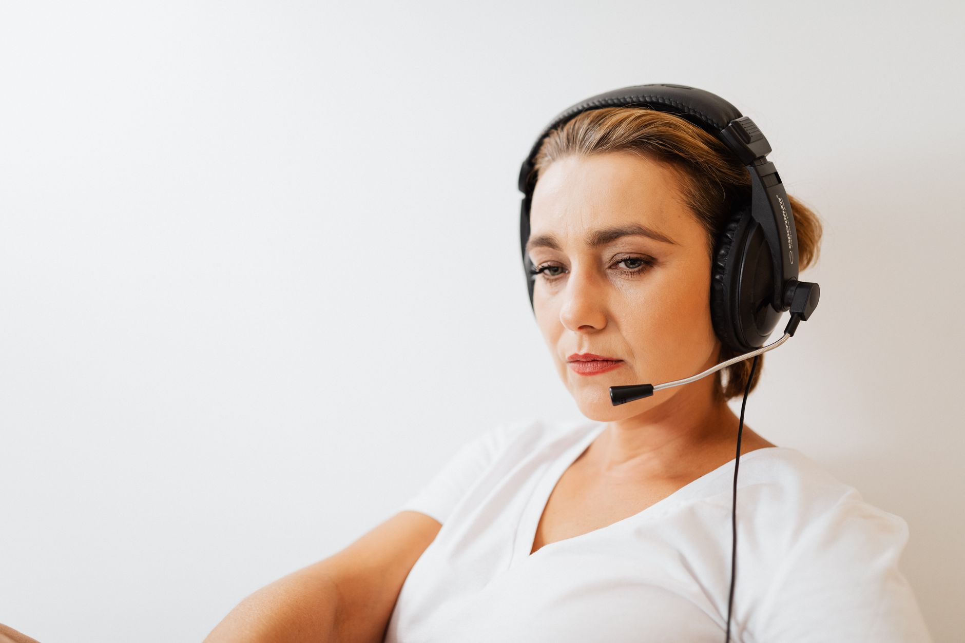 Contractor reviewing stack of invoices and unexpected billing statements